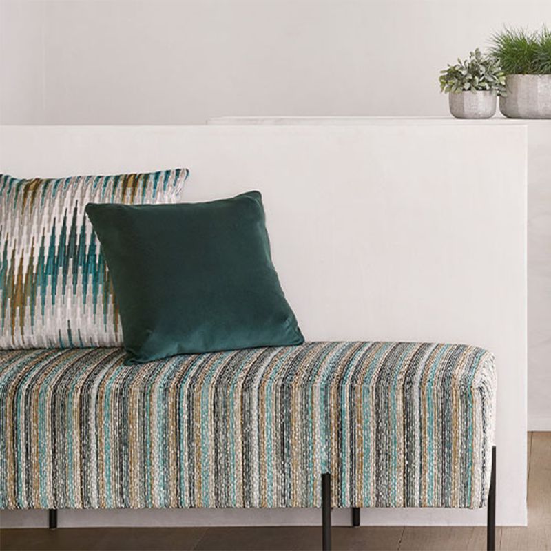 A tasteful teal cushion with a luxurious soft velvet cover, linen reverse and feather insert