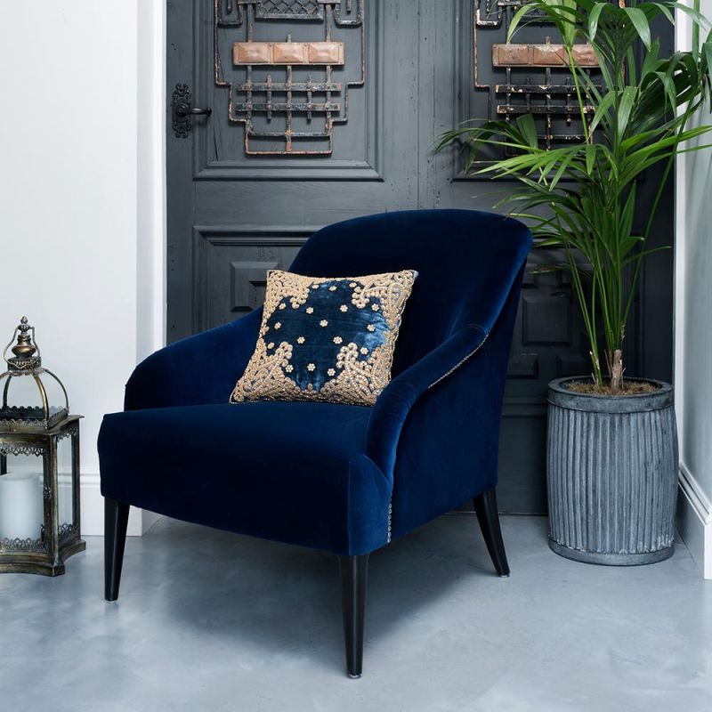 Royal blue velvet, gold studded armchair
