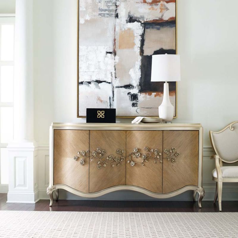 A luxurious champagne-coloured sideboard with interior shelving and drawers