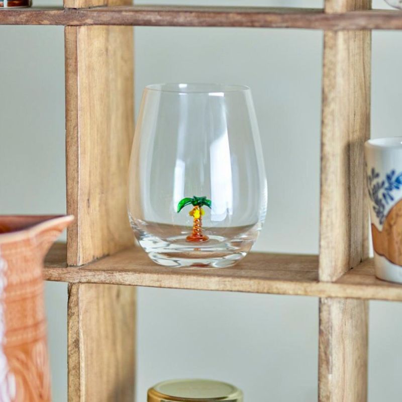 Clear drinking palm with flower at base