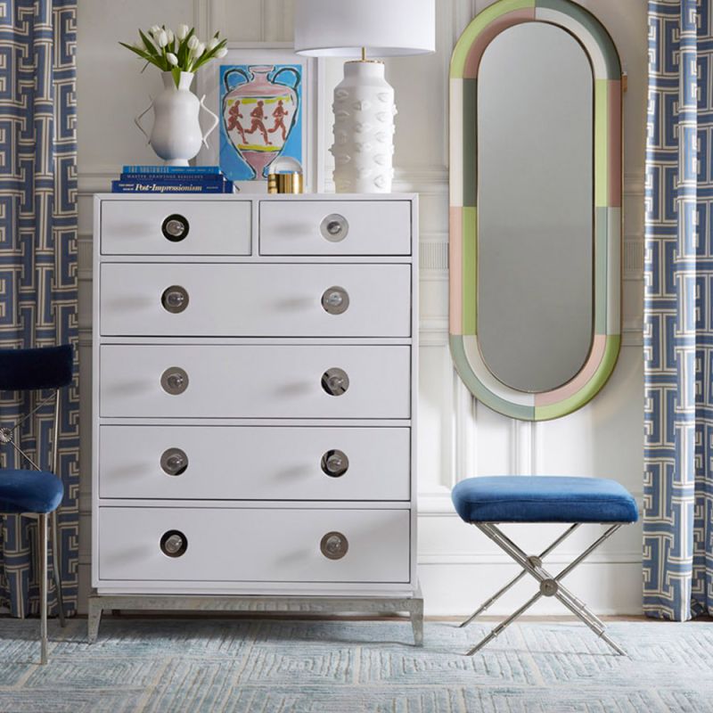 A glamorous Hollywood-inspired six drawer chest with acrylic and nickel details