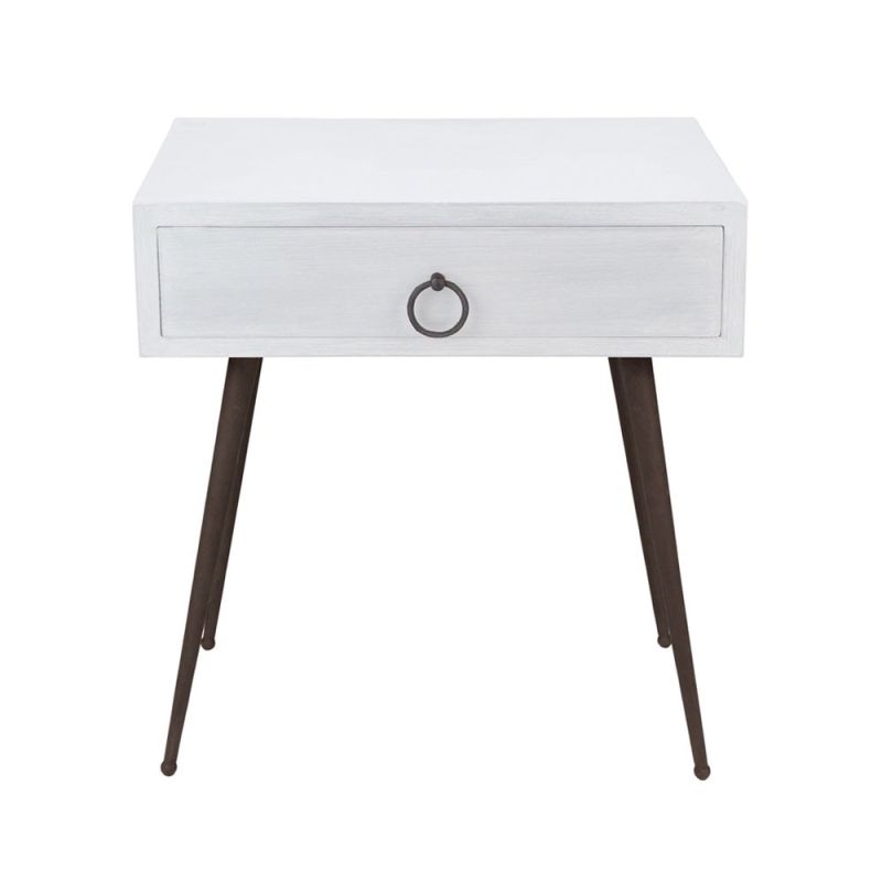 A luxurious, minimal beside table in a brushed white finish with contrasting dark wood legs