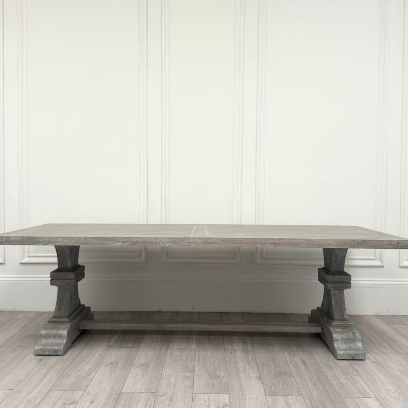 Large grey dining table with washed wood finish