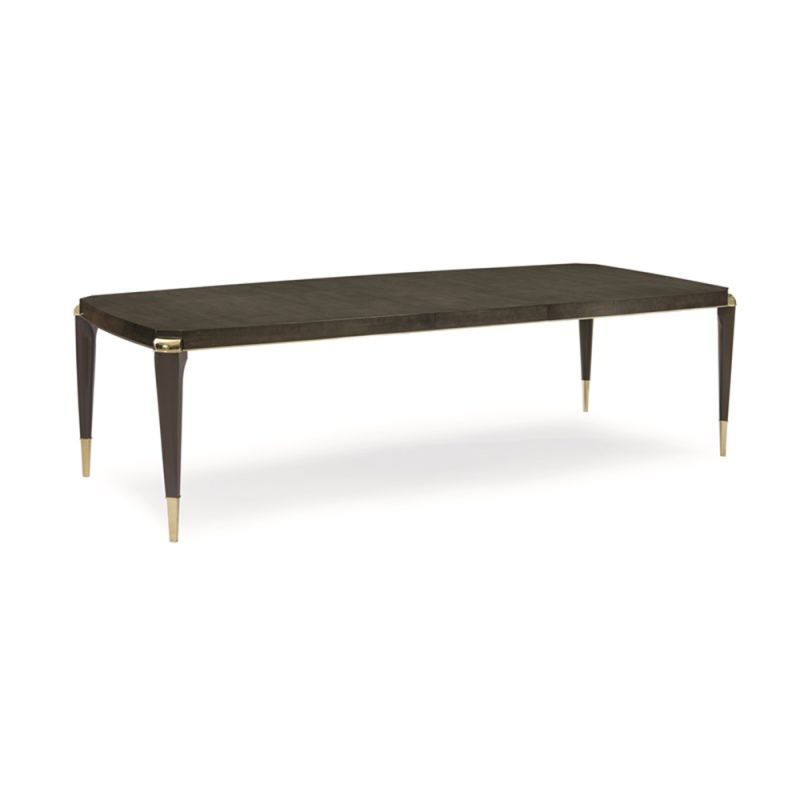 A luxury extendable dining table by Caracole with glamorous gold details