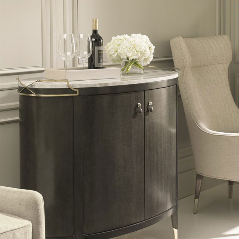 Graceful, rich brown bar cabinet with marble top and delicate champagne details