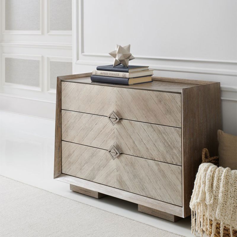 Modern chest of drawers with gorgeous chevron detailing and dark gold diamond handles 