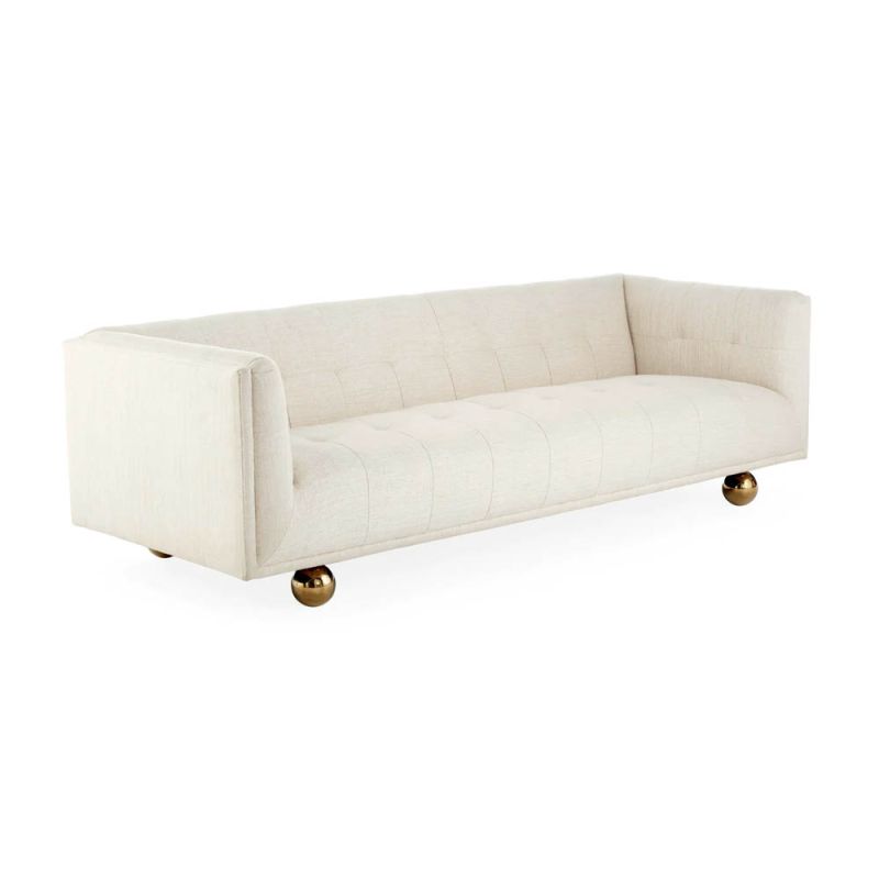 A stylish sofa by Jonathan Adler with a luxury cream upholstery and glamorous gold orb feet