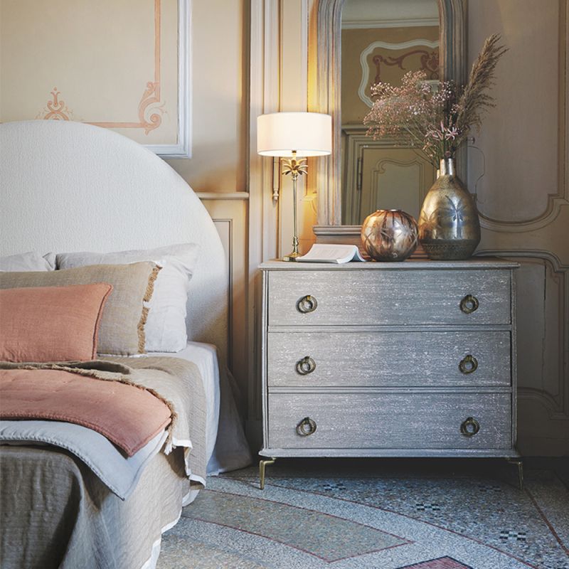 Chic, French-style chest of drawers with rounded handles. 