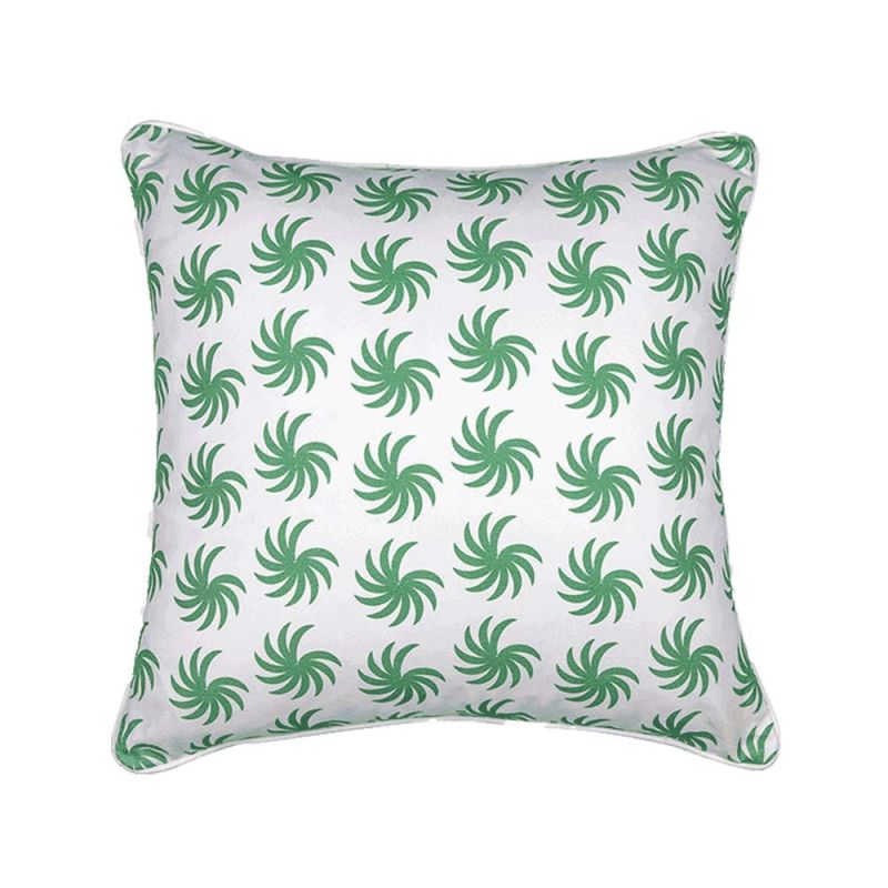 A square cushion with green palms and a white background