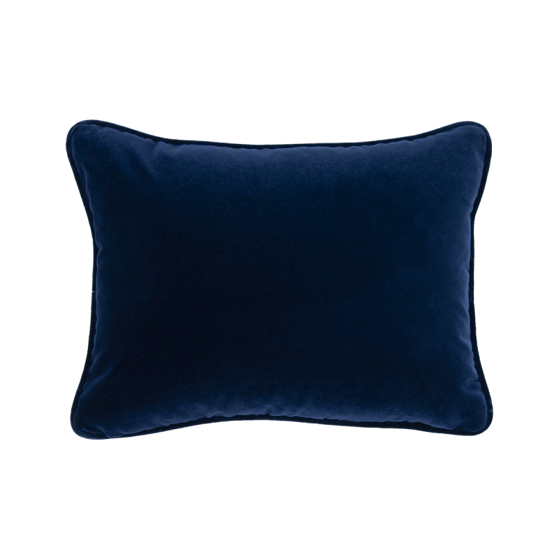 A rich dark blue velvet cushion with a rectangular shape 