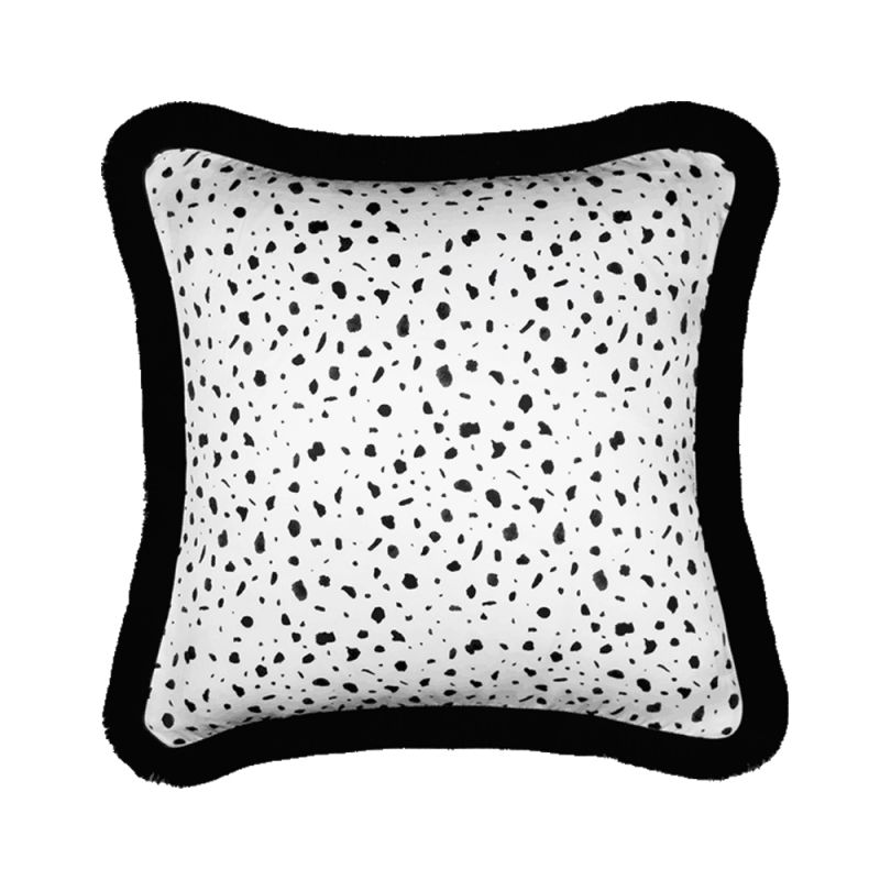 A glamorous black and white cushion with black fringing