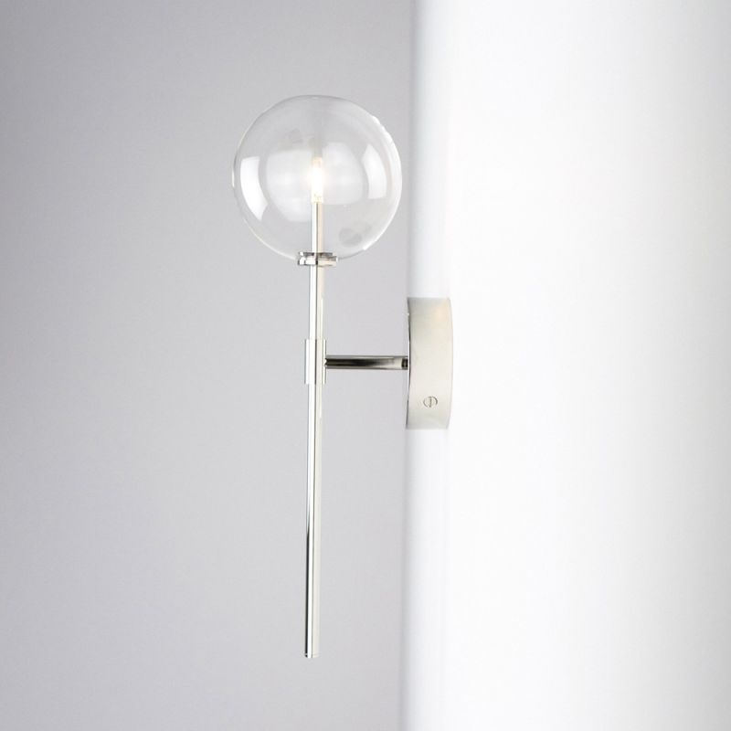 Contemporary industrial wall lamp in polished nickel finish with a large clear glass sphere lampshade