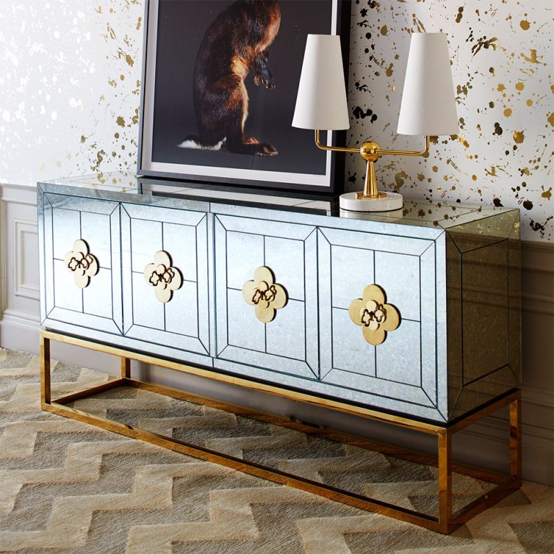 An elegant antiqued glass and polished brass maximalist credenza