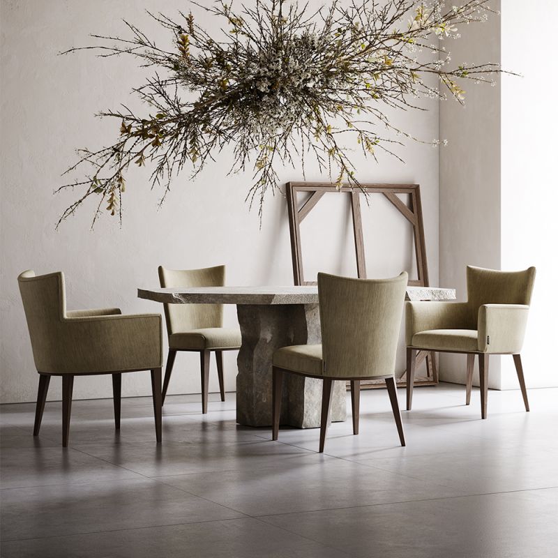 A glamorous modern dining chair with velvet upholstery and wooden legs