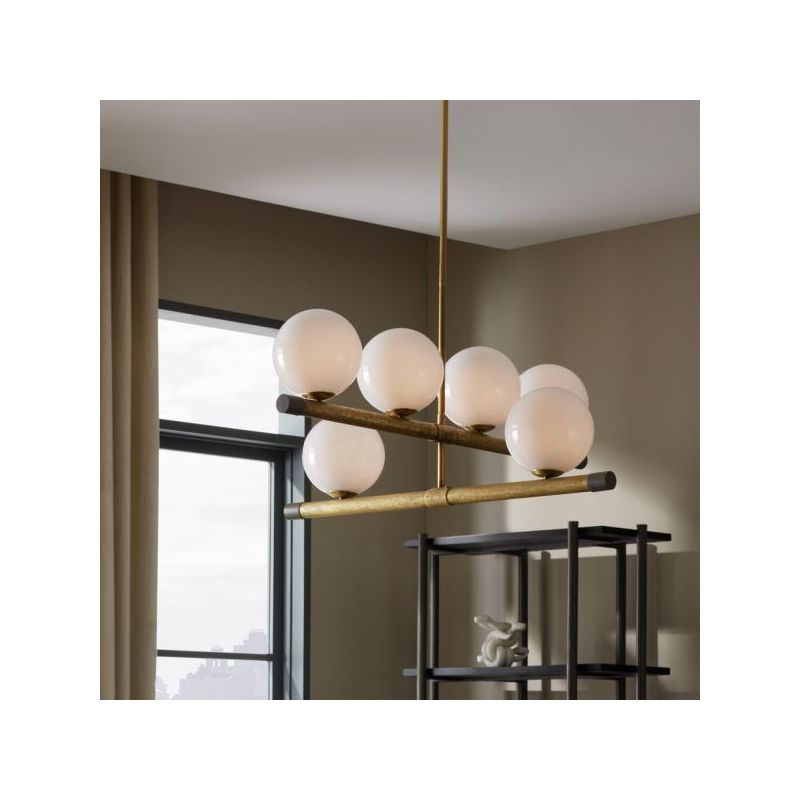 Chandelier with orb shades along brass poles