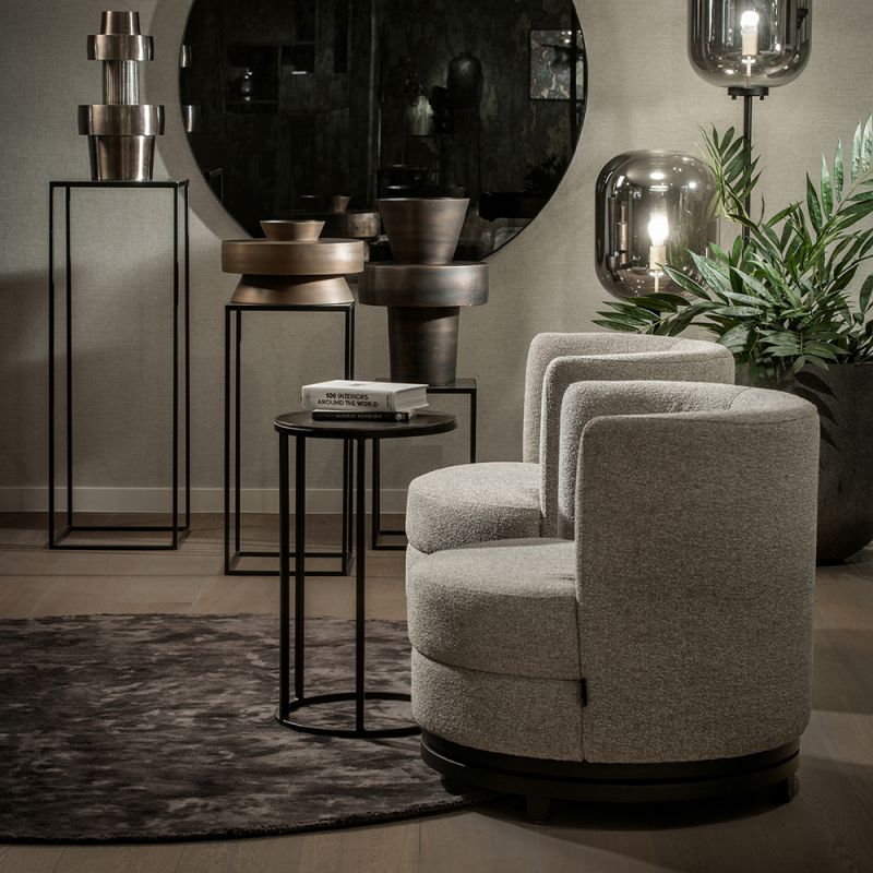 A stylish swivel chair by Dome Deco with a beautiful bespoke upholstery