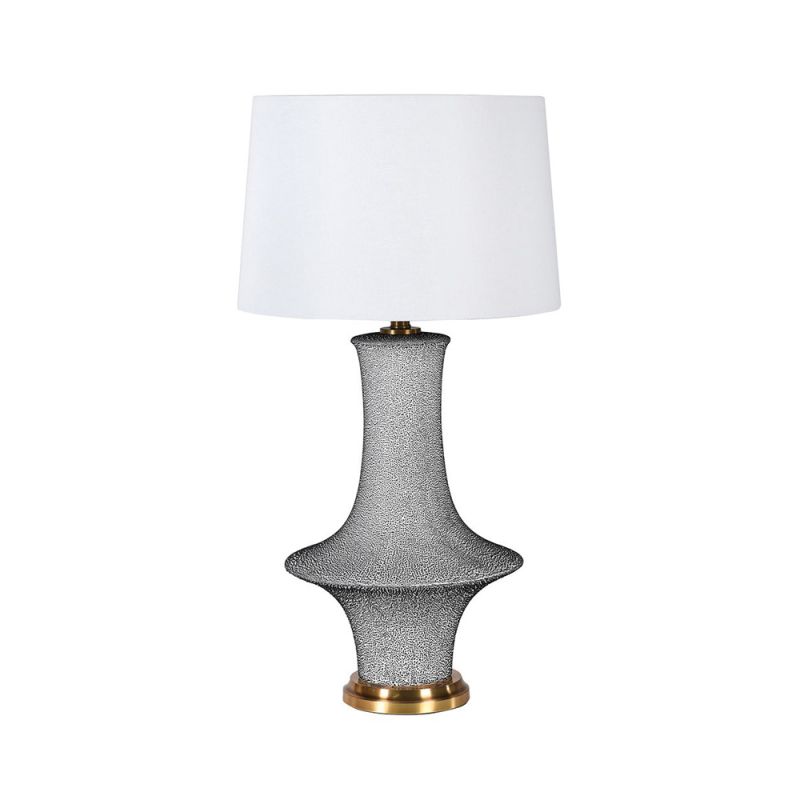 A luxurious table lamp with a white linen shade