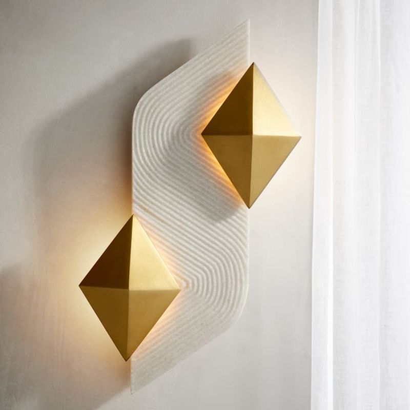 Illuminate your space with the elegant Jenner Sconce, featuring a stylish design that blends modern aesthetics with functional lighting. Perfect for any room!