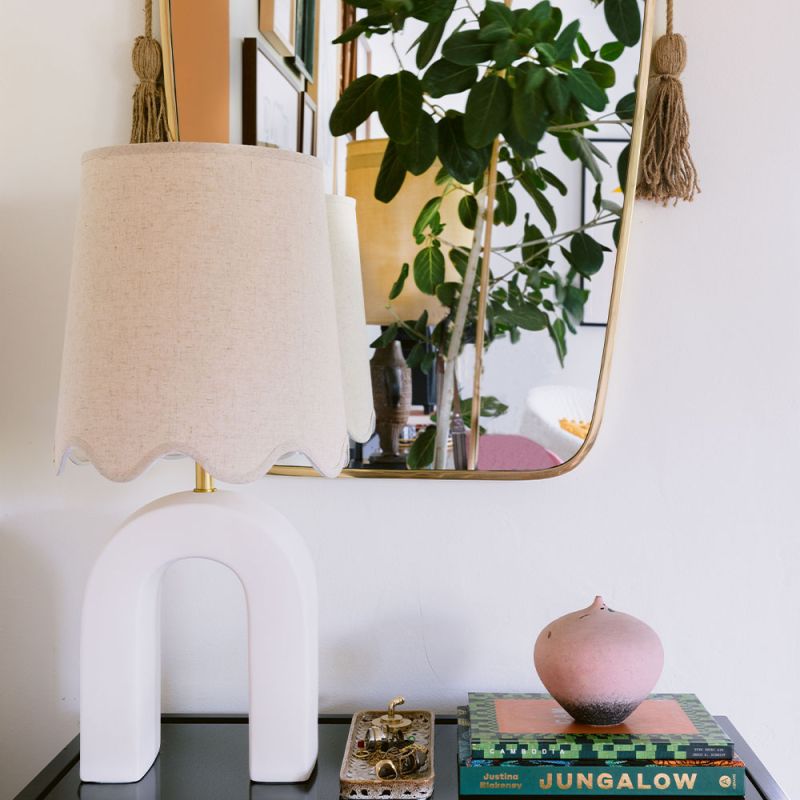 Side lamp with arched base and scalloped shade