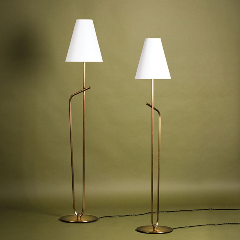 Floor lamp with golden base and white lampshade