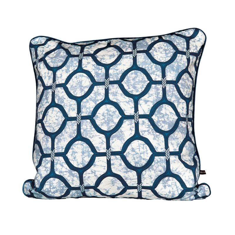 A luxury cushion by Eva Sonaike with a blue African-inspired pattern