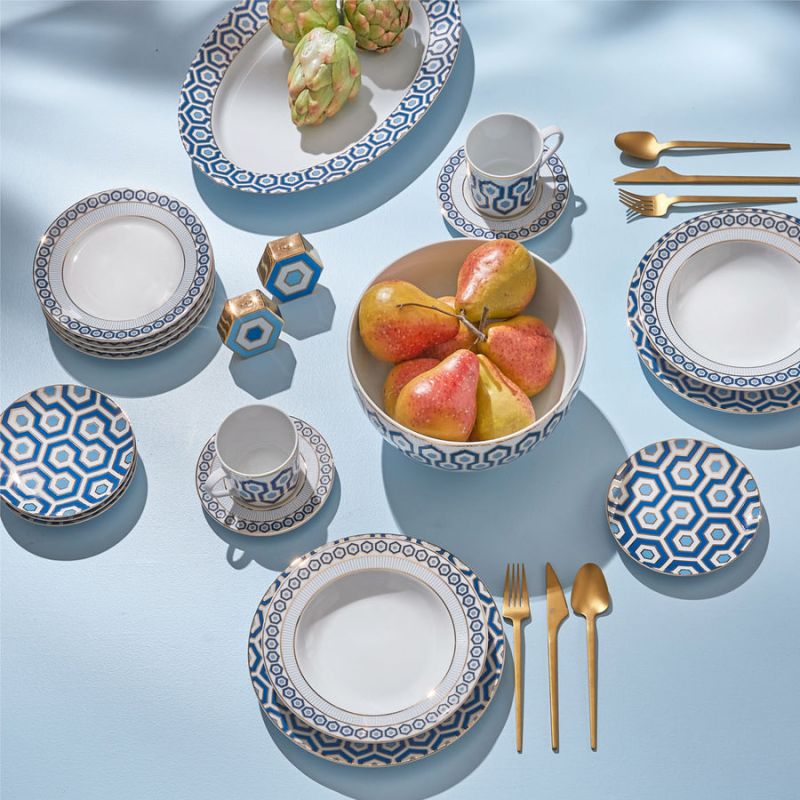 A saucer featuring a signature hexagon pattern in blue and gold, ideal for adding sophistication to your tablescape.