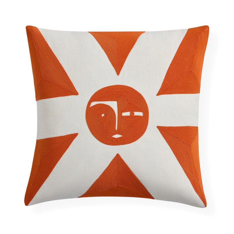 White cushion with orange sun detail