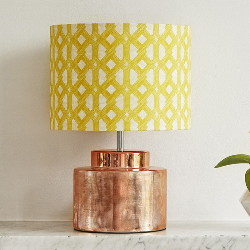 A luxury lampshade by Eva Sonaike with a yellow African-inspired pattern