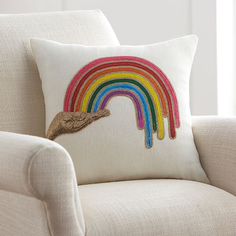 A beautiful hand beaded cushion by Jonathan Adler with a rainbow design and linen cover  