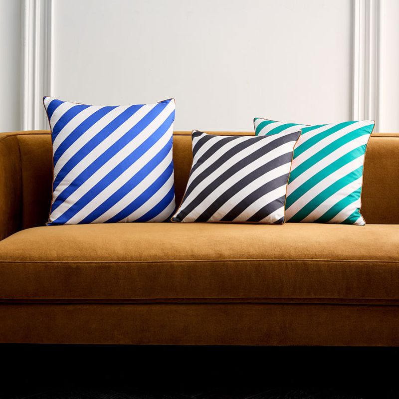 The Cabana Cushion features classic stripes printed on luxurious silk, adding a prep-inspired touch to any pillowscape.
