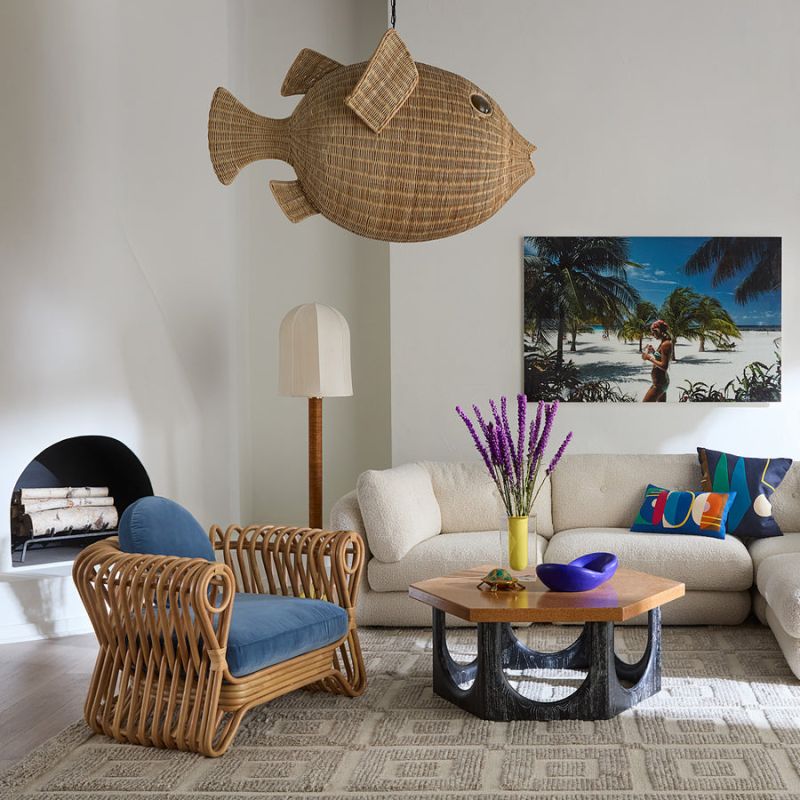 The St Tropez Lounge Chair blends coastal charm and haute couture with hand-coiled reeds and blue velvet cushions, finished with satin lacquer.