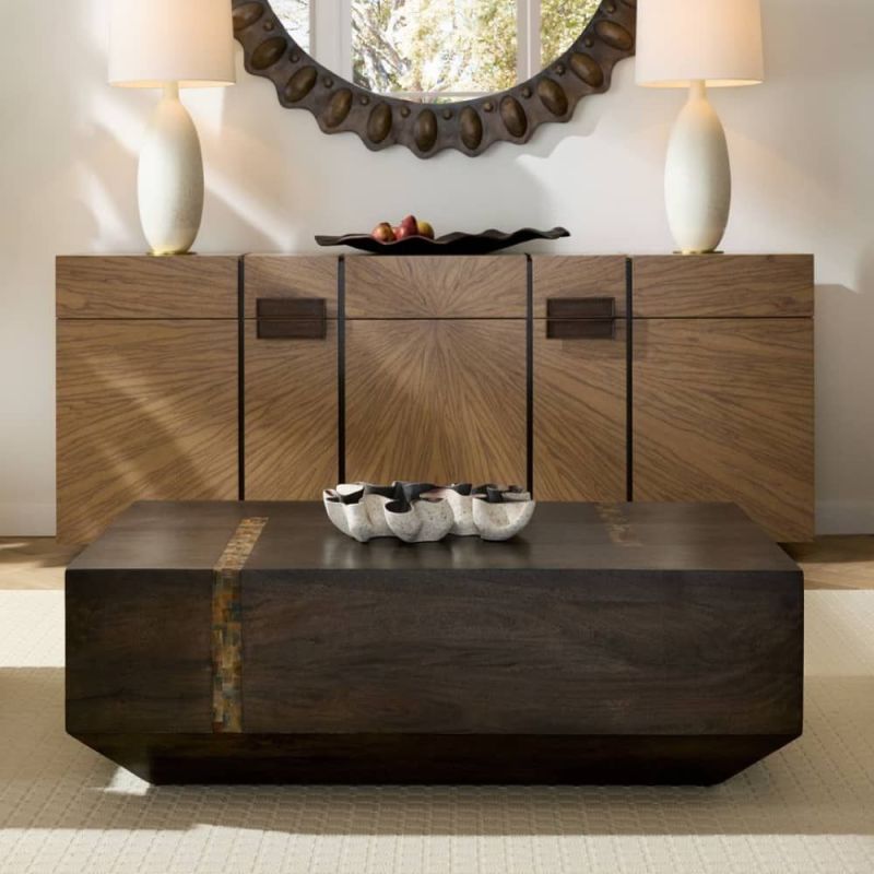 Angular rectangular cocktail table in dark wood finish.