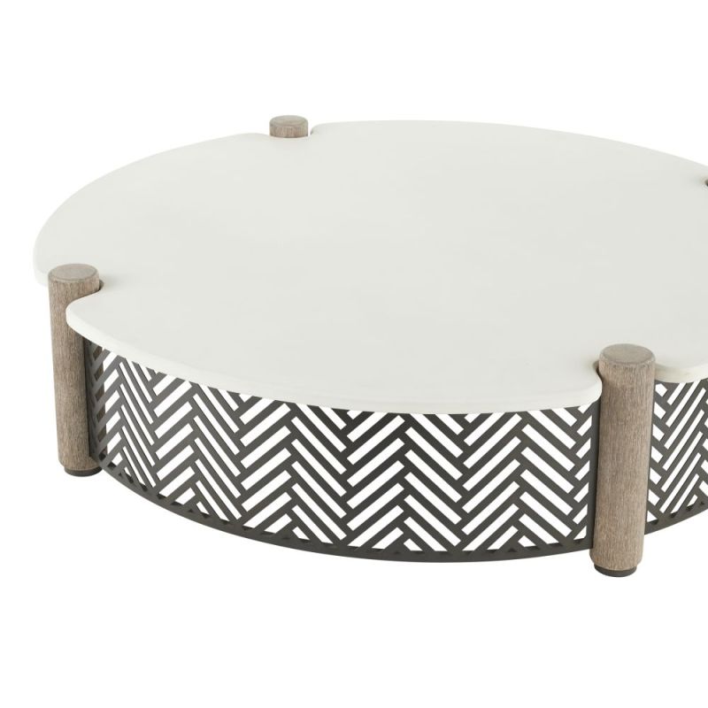 Round coffee table with a concrete top, four wooden dowels, and a black and white geometric print exterior
