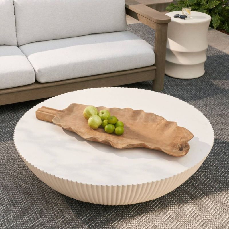 Round concrete coffee table with fluted edges