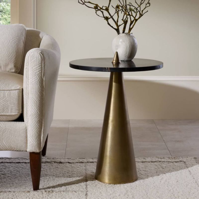 Side table with sharp antique brass base and black round table top
