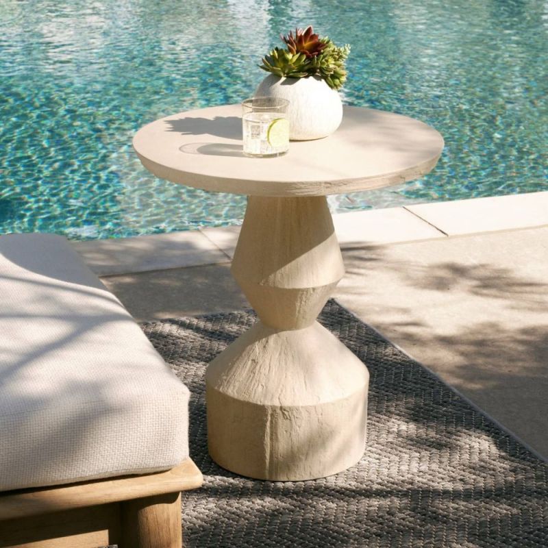 Side table made of concrete composite when an angular geometric base and cylindrical top