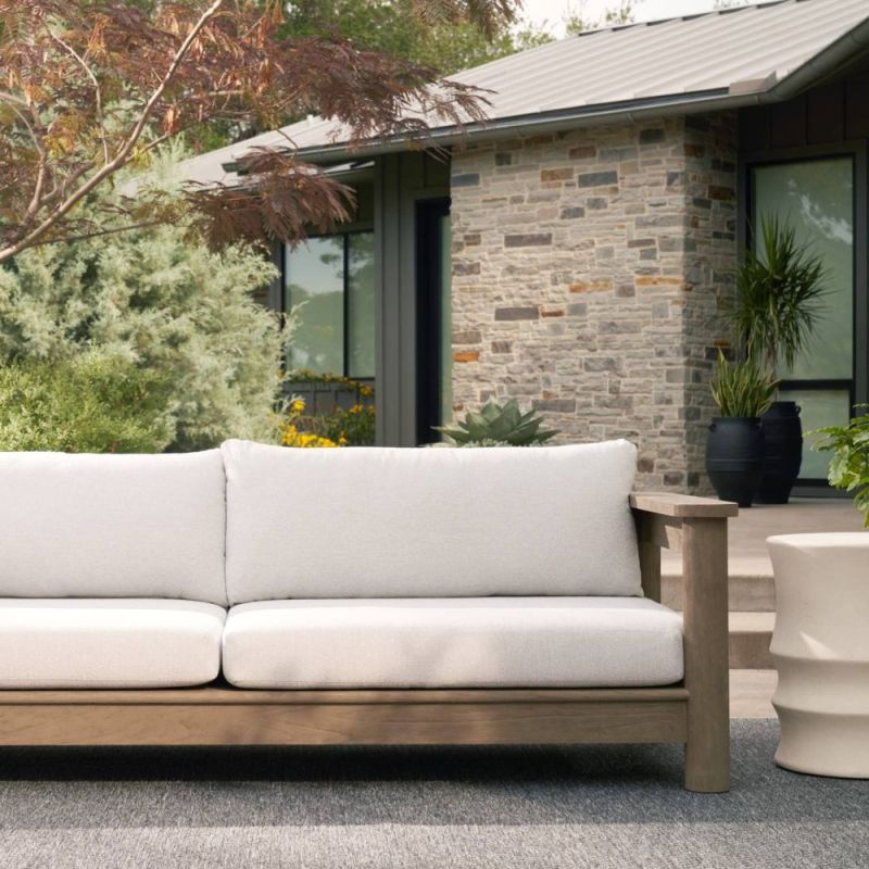 Elevate your outdoor space with the Caldwell Outdoor Sofa in Porpoise Boucle. Stylish, durable, and comfortable for any gathering. Relax in luxury!