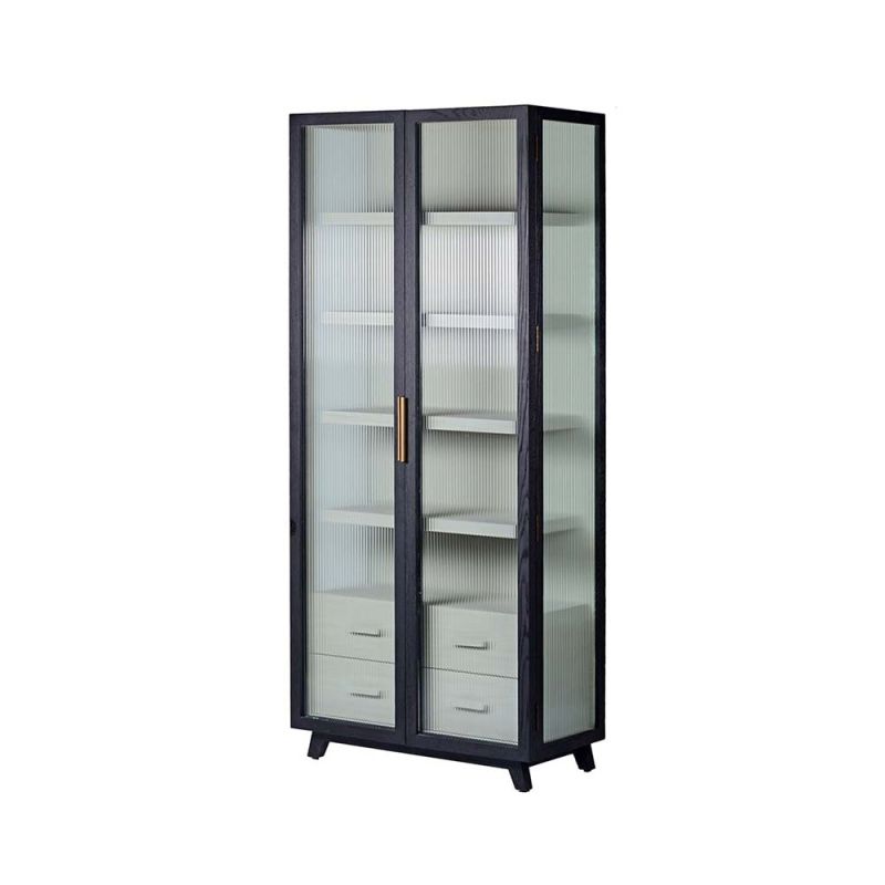 A decadent display cabinet with fluted glass doors and brass handles