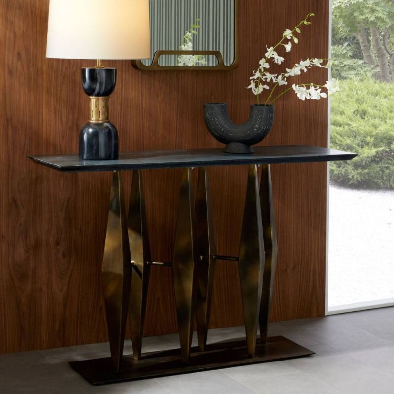 Console table with black marble top and sculptural gold base