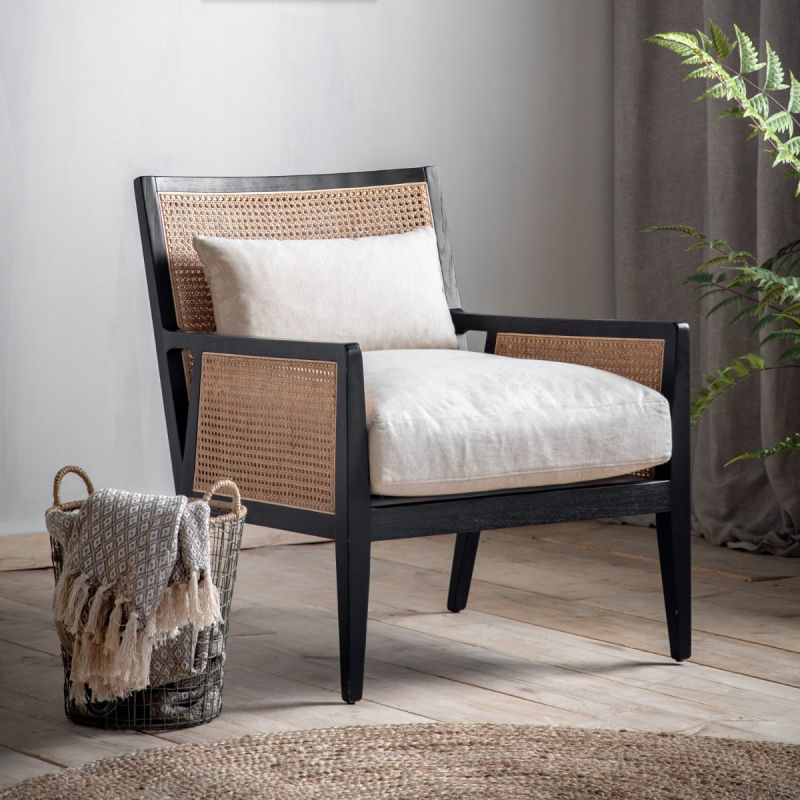 Lovely unusual armchair featuring a solid timber frame with a black finish