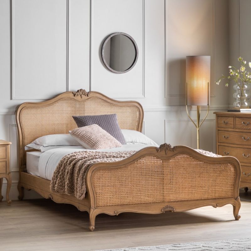 French-style wooden bed with rattan headboard