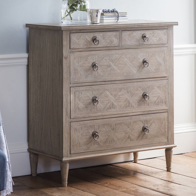 Light wooden five drawer chest of drawers