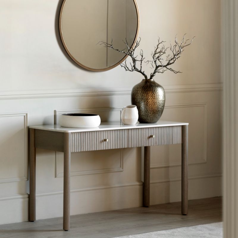 Console with striking vertical ribbed feature on the drawers and polished white marble top