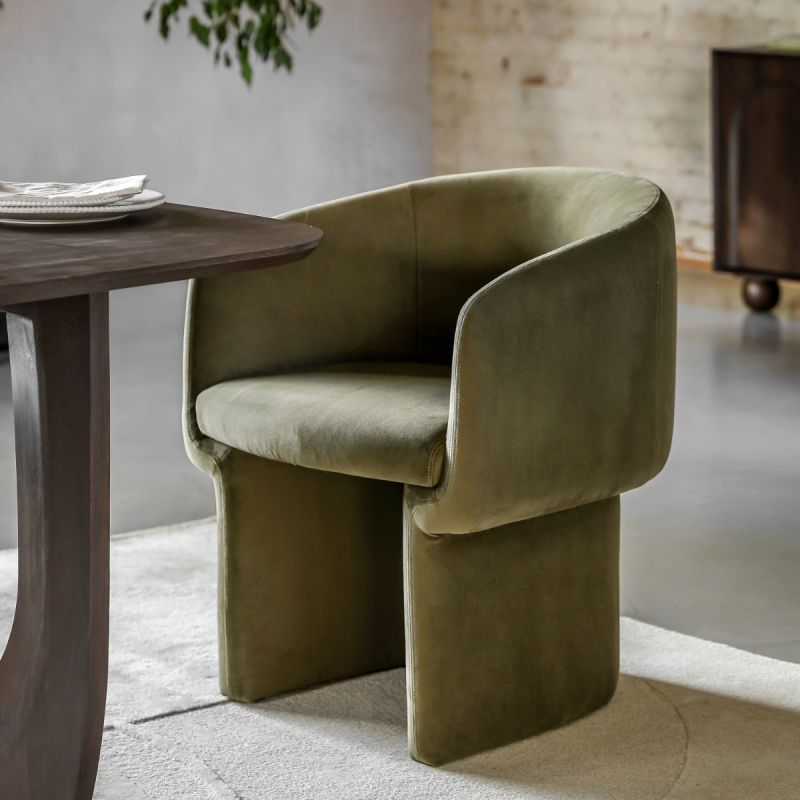 Tub-shaped dining chair with smooth green fabric