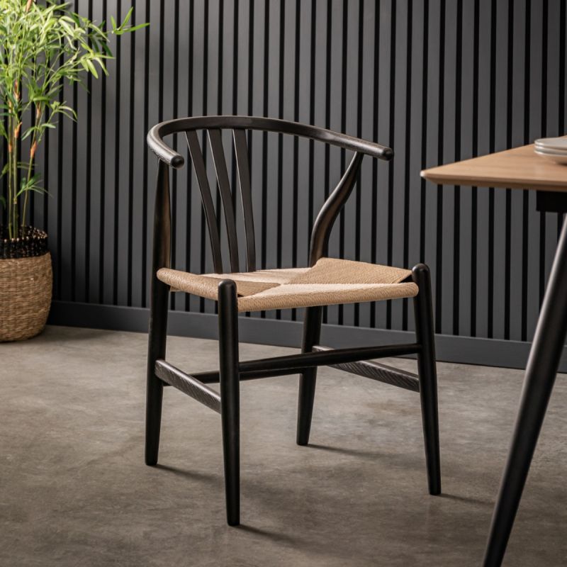 Wishbone back dining chairs with deeply curved back and distinctive hand woven seat