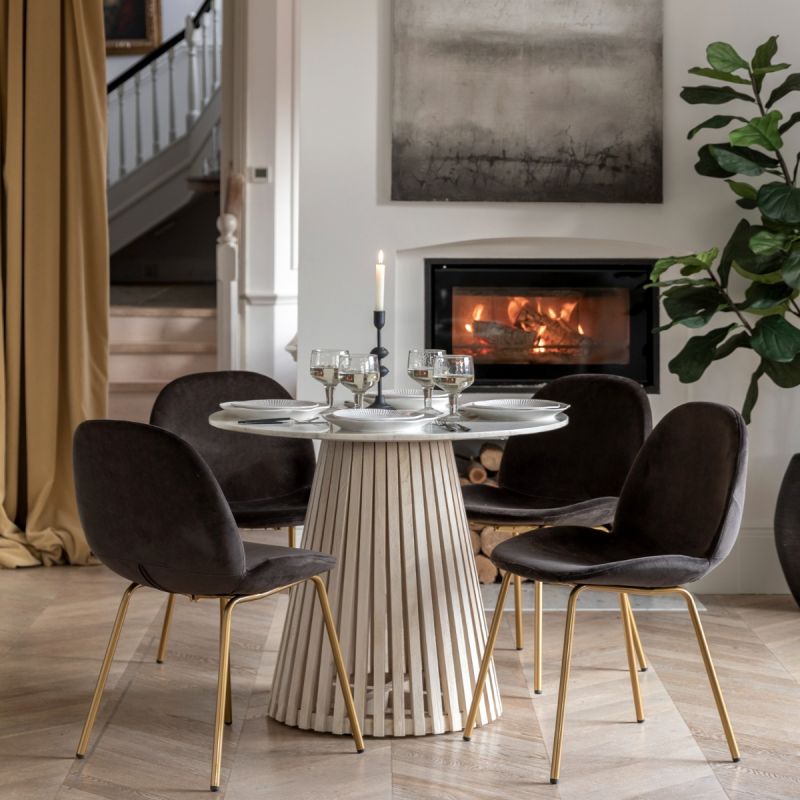 Marble top round dining table with gentle sloping slats for base