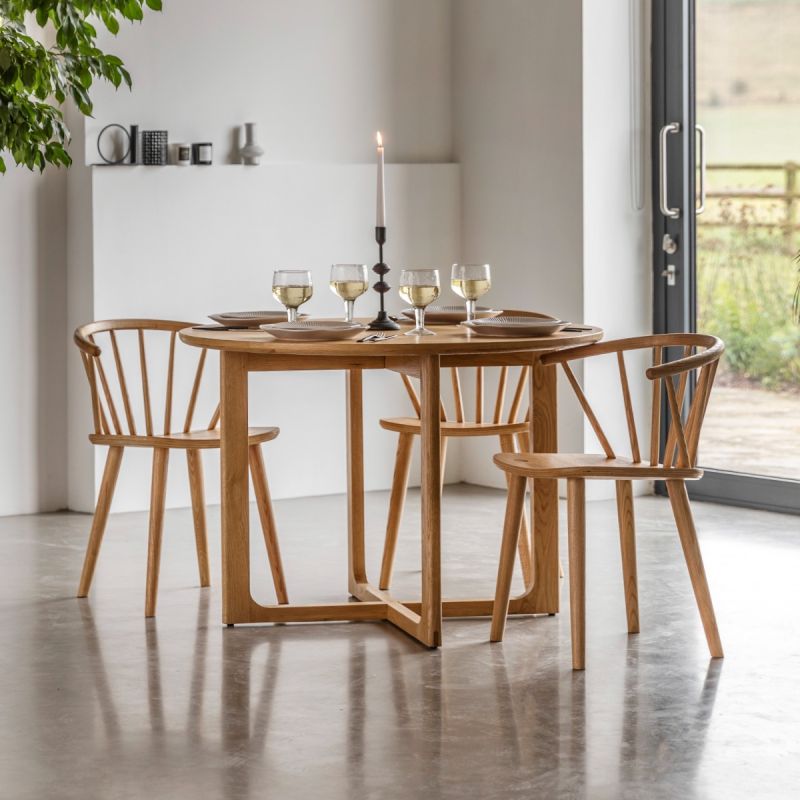 Wooden dining table with shaped underframe