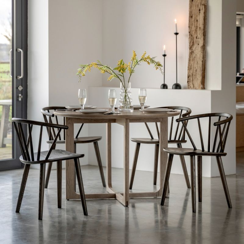 Wooden dining table with shaped underframe