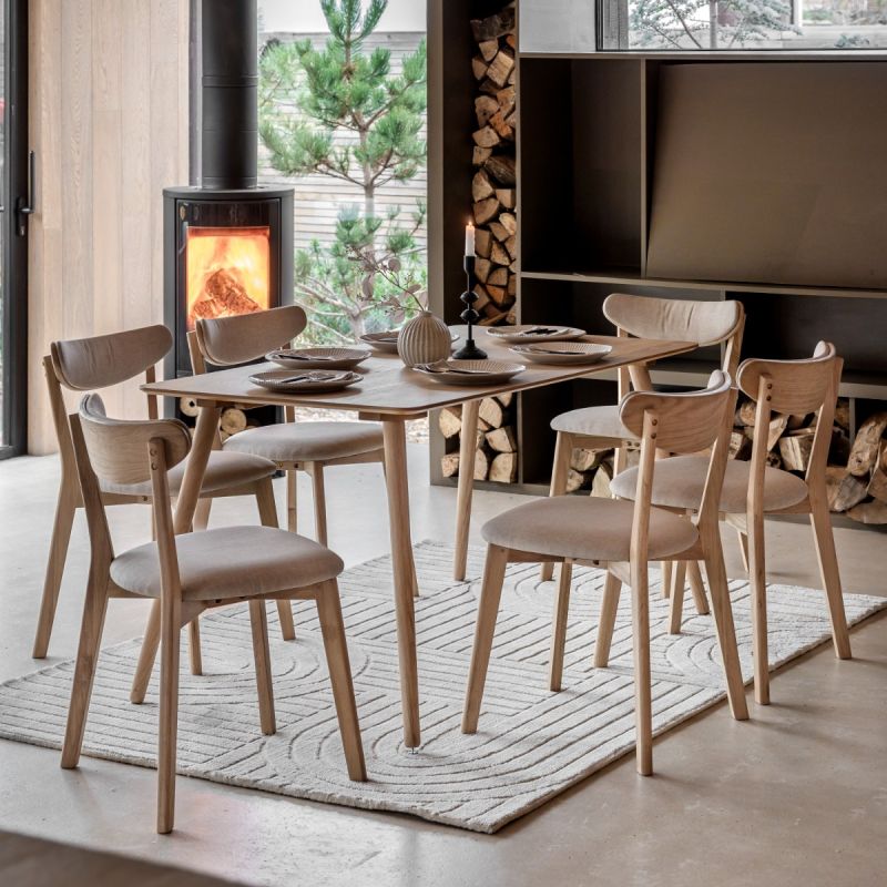 Triangular wooden dining table with three legs