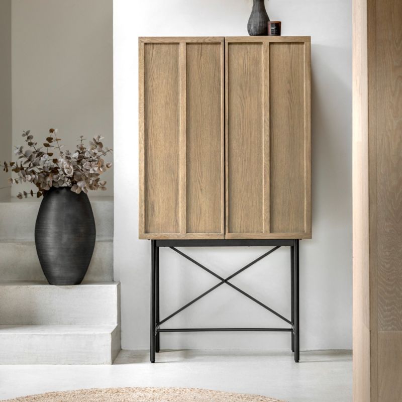 Beautiful cocktail cabinet in oak veneer with a weathered grey finish, paired with black metal legs